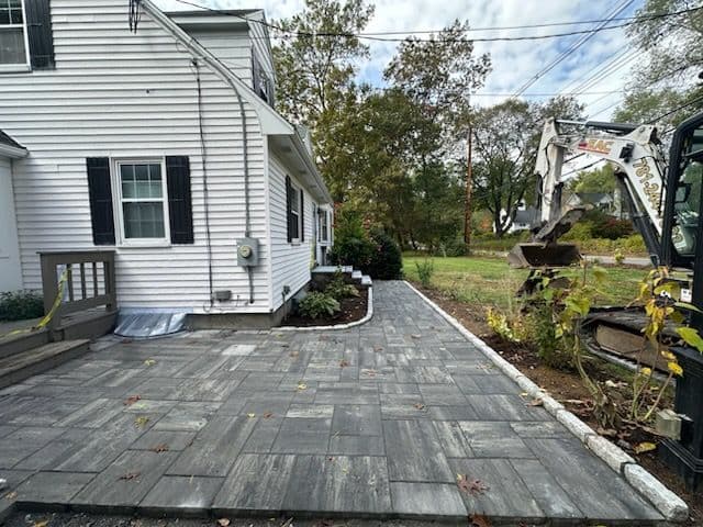 Elegant Stone Path Installation Transforms Home Entryway image