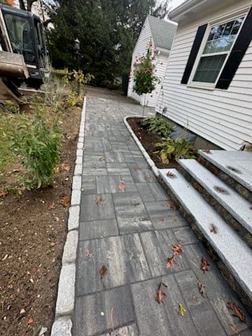 Gallery photos for Elegant Stone Path Installation Transforms Home Entryway: Image #1